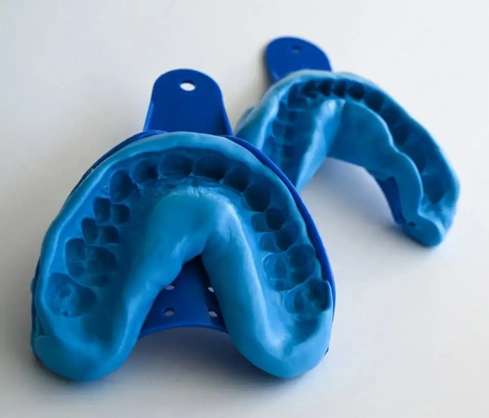 Dental impression tray, spatula and materials prepared for taking an impression